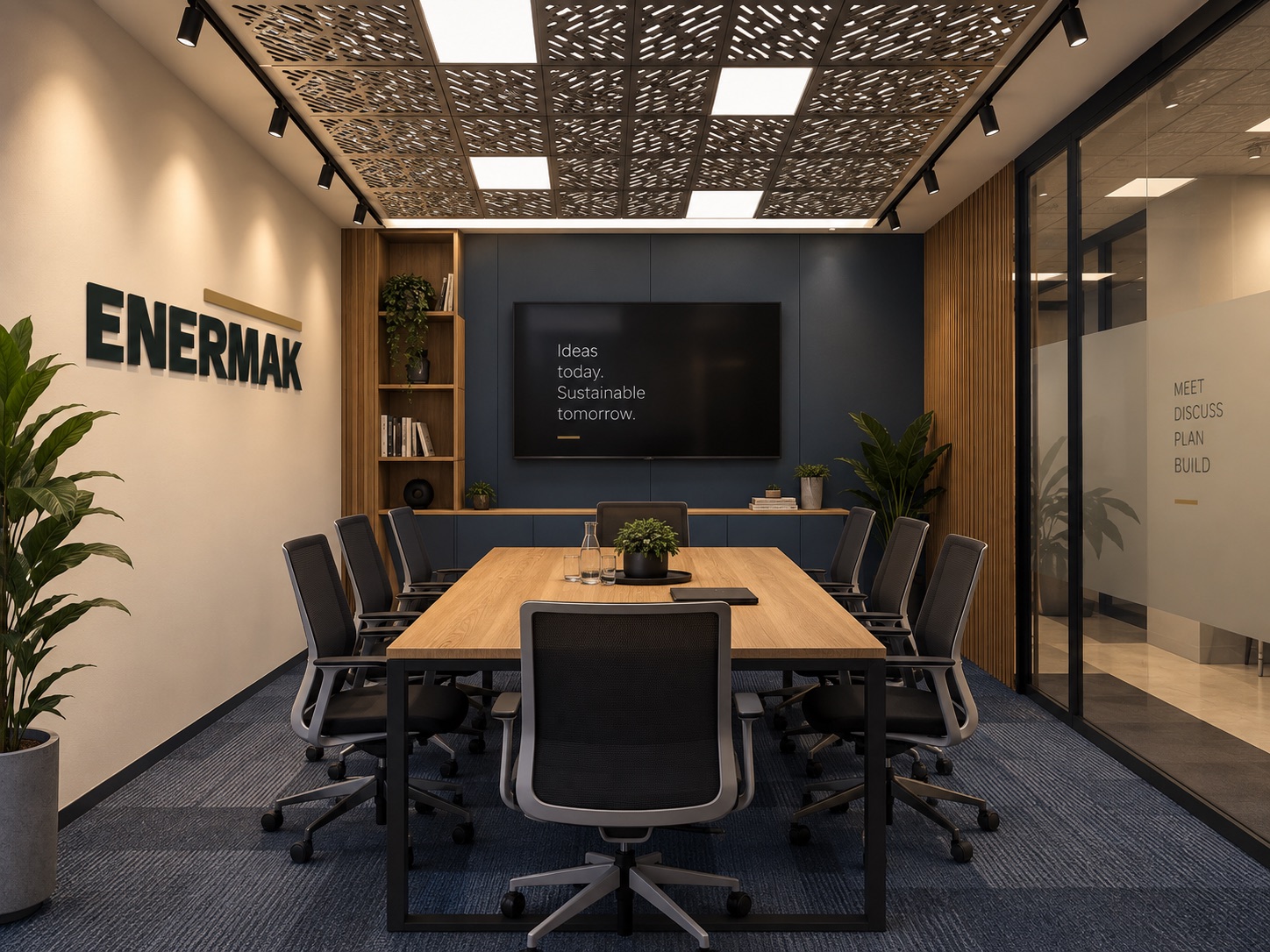 Enermak meeting room with a long table, chairs and a wall screen